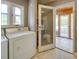 Laundry room with washer, dryer, and access to a screened porch at 846 Windy Oaks Way, Lancaster, SC 29720