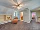 Spacious bedroom with built-in shelving and a chaise lounge at 846 Windy Oaks Way, Lancaster, SC 29720