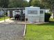 Camper with covered patio and golf cart at 134 Dove Ln, New London, NC 28127