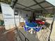 Dutchmen Classic mobile home with covered patio and golf cart at 134 Dove Ln, New London, NC 28127