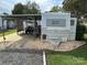 Camper with covered patio and golf cart at 134 Dove Ln, New London, NC 28127