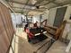Covered patio with golf cart and small table set at 134 Dove Ln, New London, NC 28127