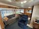 Open living space with a sofa, recliner, and view into the kitchen at 134 Dove Ln, New London, NC 28127