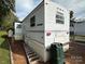 Side view of a white camper with ladder at 134 Dove Ln, New London, NC 28127