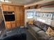 Comfortable living room with couch and built-in shelving at 134 Dove Ln, New London, NC 28127