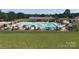 Large community pool with plenty of lounge chairs and umbrellas at 134 Dove Ln, New London, NC 28127