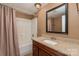 Clean bathroom, granite countertop, and bathtub shower at 4108 Scarlet St, Matthews, NC 28104
