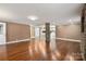 Spacious living room featuring hardwood floors and a stone fireplace at 4108 Scarlet St, Matthews, NC 28104