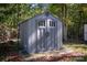 Gray plastic storage shed in backyard at 4108 Scarlet St, Matthews, NC 28104