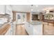 Open kitchen boasts granite counters, white cabinets, and views to the dining area at 4108 Scarlet St, Matthews, NC 28104