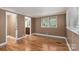 Simple bedroom with hardwood floors and access to a full bathroom at 4108 Scarlet St, Matthews, NC 28104