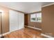 Bright bedroom with hardwood floors and double door closet at 4108 Scarlet St, Matthews, NC 28104