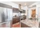 Modern kitchen with stainless steel appliances and granite countertops at 1100 Metropolitan Ave # 305, Charlotte, NC 28204