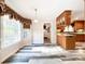 Bright dining area with wood flooring and view into kitchen at 3018 Castlebrook Dr, Monroe, NC 28112
