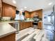 Spacious kitchen with wood cabinets, stainless steel appliances and vinyl flooring at 3018 Castlebrook Dr, Monroe, NC 28112