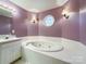 Relaxing bathroom with a large corner jacuzzi tub at 3018 Castlebrook Dr, Monroe, NC 28112