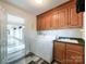 Laundry room with washer, dryer, cabinets, and sink at 3018 Castlebrook Dr, Monroe, NC 28112