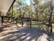 Deck overlooking backyard with firepit and wooded area at 3018 Castlebrook Dr, Monroe, NC 28112