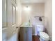 Small bathroom with glass sink, toilet and a towel rack at 3018 Castlebrook Dr, Monroe, NC 28112