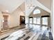 Great room with vaulted ceiling, fireplace, and access to patio at 3018 Castlebrook Dr, Monroe, NC 28112