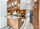 Spacious kitchen with wood cabinets, stainless steel appliances and vinyl flooring at 3018 Castlebrook Dr, Monroe, NC 28112