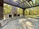 Pergola with stone fireplace and brick patio at 3018 Castlebrook Dr, Monroe, NC 28112