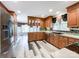 Spacious kitchen with wood cabinets, stainless steel appliances and vinyl flooring at 3018 Castlebrook Dr, Monroe, NC 28112