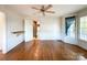 Bright dining room with hardwood floors and a view into the kitchen at 3018 Castlebrook Dr, Monroe, NC 28112