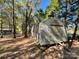 Metal storage shed in wooded backyard setting at 3018 Castlebrook Dr, Monroe, NC 28112