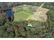 Aerial view of house and large lot with pond nearby at 3018 Castlebrook Dr, Monroe, NC 28112