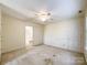Large bedroom with ceiling fan and access to upper hallway at 3018 Castlebrook Dr, Monroe, NC 28112