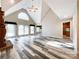 Open great room with hardwood floors and kitchen access at 3018 Castlebrook Dr, Monroe, NC 28112