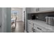 White kitchen cabinets and gray tile backsplash with coffee bar at 2680 Andes Dr, Statesville, NC 28625