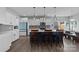 Modern kitchen with white cabinets, gray backsplash, and a blue island at 2680 Andes Dr, Statesville, NC 28625