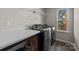 Laundry room with washer, dryer, and built-in shelving at 2680 Andes Dr, Statesville, NC 28625