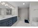 Double vanity bathroom with navy cabinets and shower at 2680 Andes Dr, Statesville, NC 28625