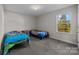 Bright bedroom with two twin beds and window at 2680 Andes Dr, Statesville, NC 28625