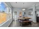 Bright dining area with wooden table and access to backyard at 2680 Andes Dr, Statesville, NC 28625