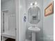 Stylish powder room with pedestal sink and mirror at 2680 Andes Dr, Statesville, NC 28625