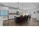 Modern kitchen with white cabinets, gray backsplash, and a blue island at 2680 Andes Dr, Statesville, NC 28625