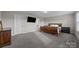 Spacious bedroom with wood bed frame and dresser at 2680 Andes Dr, Statesville, NC 28625