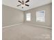 Spacious bedroom with neutral carpeting and ceiling fan at 2013 Firefly Ln, Fort Mill, SC 29715