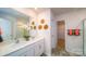 Double vanity bathroom with walk-in shower and plenty of storage at 3668 Charles Nw St, Conover, NC 28613
