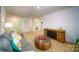Bright bonus room with cozy seating area and access to other rooms at 3668 Charles Nw St, Conover, NC 28613