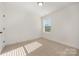 Simple bedroom with carpet and a window with blinds at 1115 S Main St, Salisbury, NC 28144