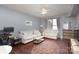 Living Room with light sofa, coffee table, and open kitchen at 1315 East Blvd # 408, Charlotte, NC 28203