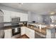 Modern kitchen with stainless steel appliances and granite countertops at 1315 East Blvd # 408, Charlotte, NC 28203