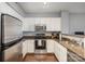 Modern kitchen with stainless steel appliances and granite countertops at 1315 East Blvd # 408, Charlotte, NC 28203