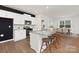 Modern kitchen featuring white cabinets, granite counters, and island at 3865 Maxwell Henry Nw Ln, Conover, NC 28613