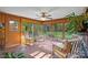 Relaxing sunroom with rocking chairs and ample natural light at 706 Crescent Dr, Lancaster, SC 29720